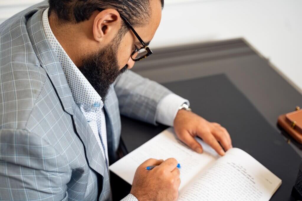 A lawyer writing on a notebook