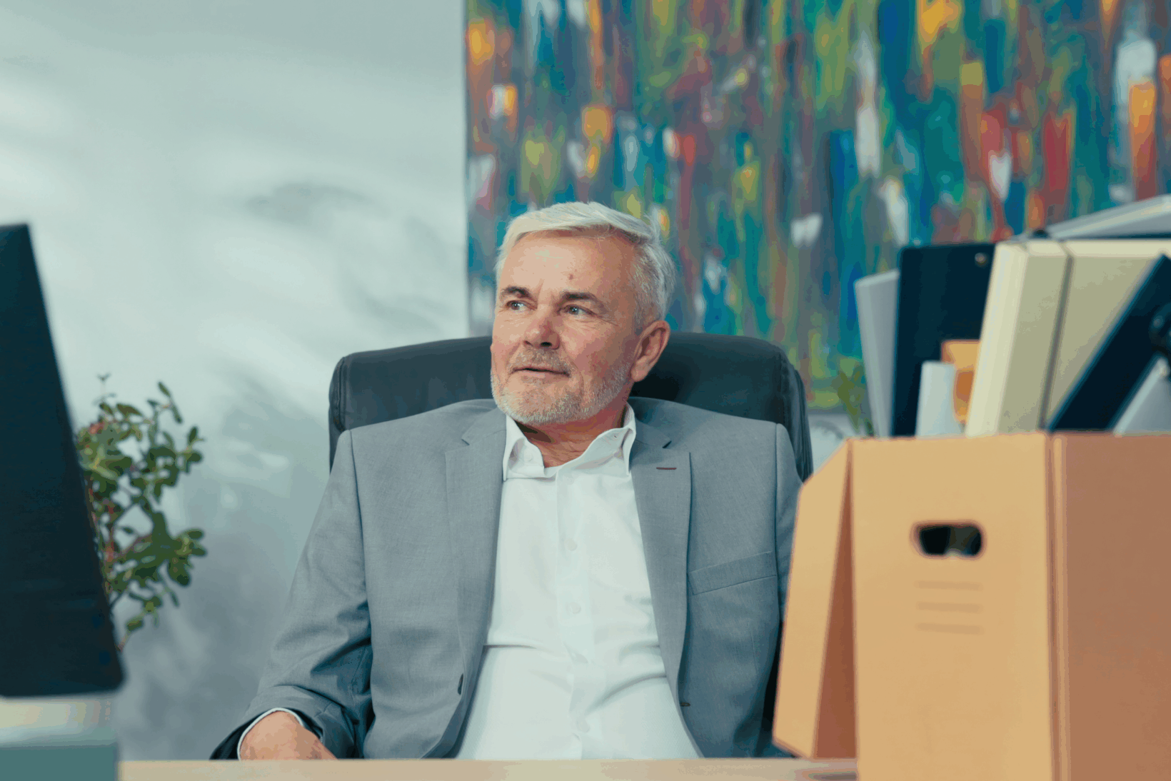 An attorney sitting at his desk just before he closes his law practice
