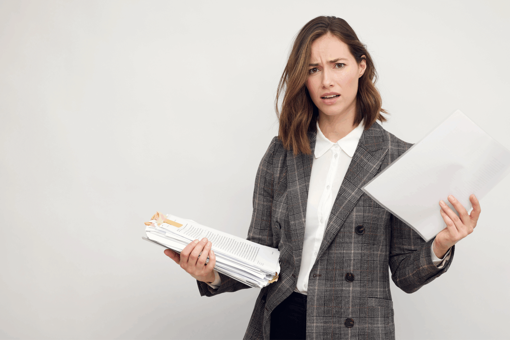 Confused probate attorney holding a stack of wills